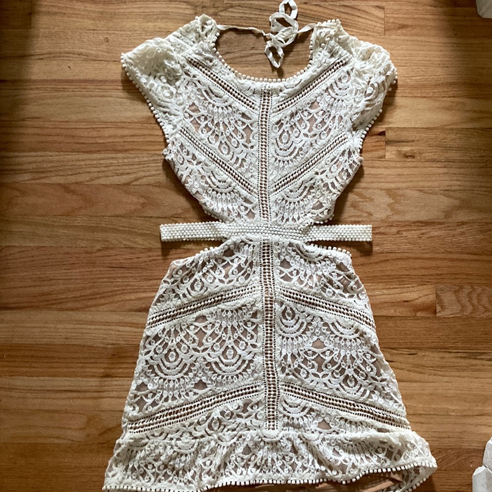 Lovely lace mini dress with open back & flutter sleeves